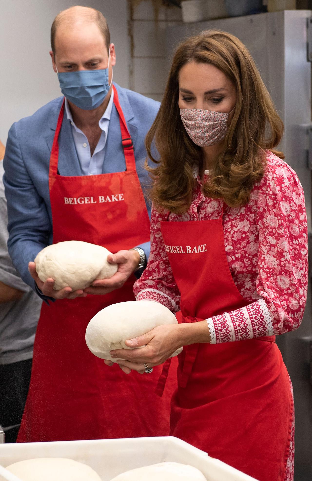 Kate Middleton and Prince William hold bread dough
