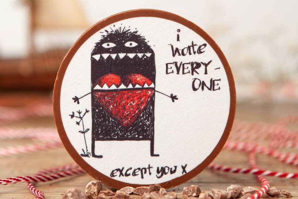I hate everyone except you chocolate medallion with a monster illustration