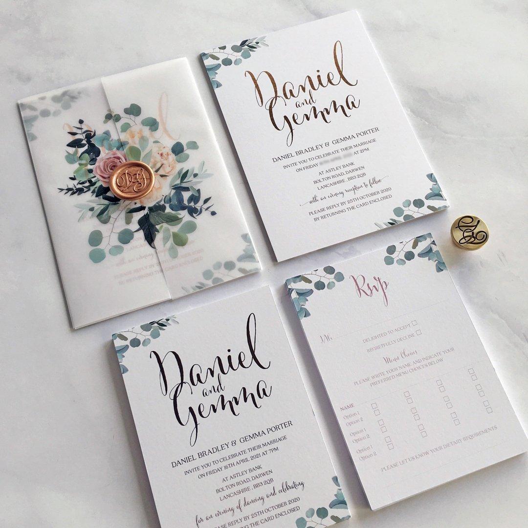 Floral and vellum wedding stationery with a vintage wax seal