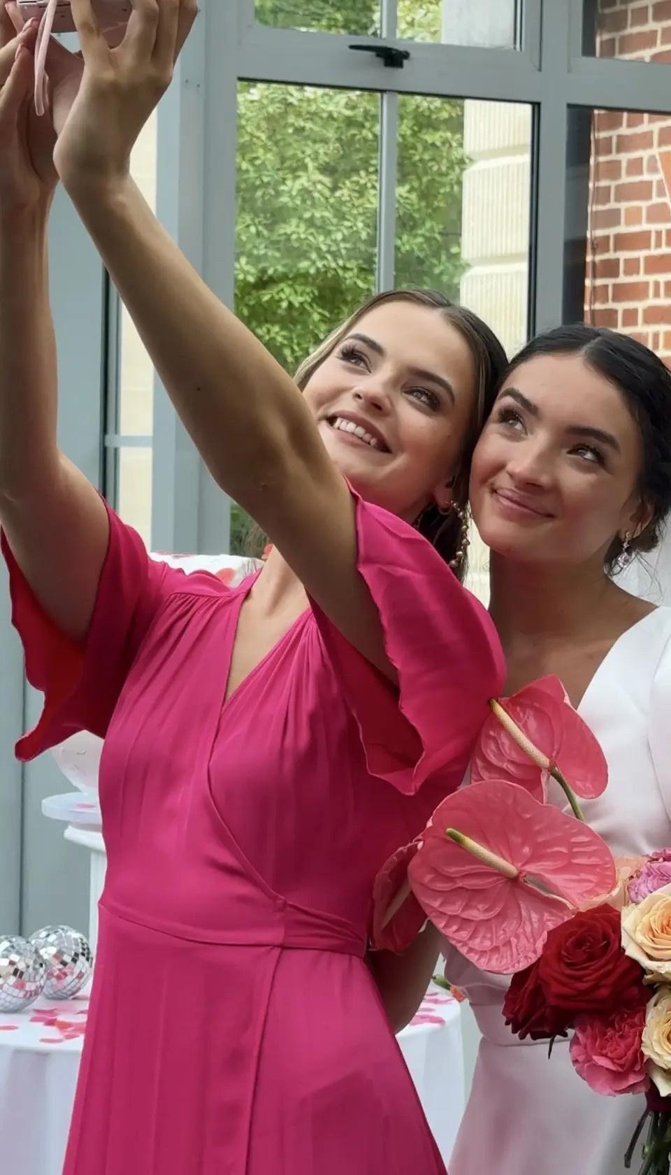 Bride and bridesmaid taking a selfie