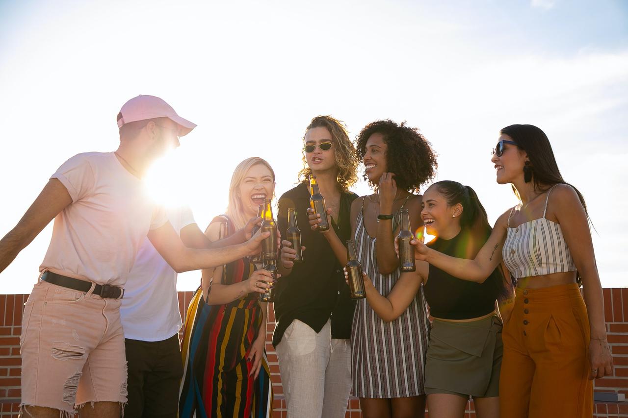 group of men and women cheersing at a sten do