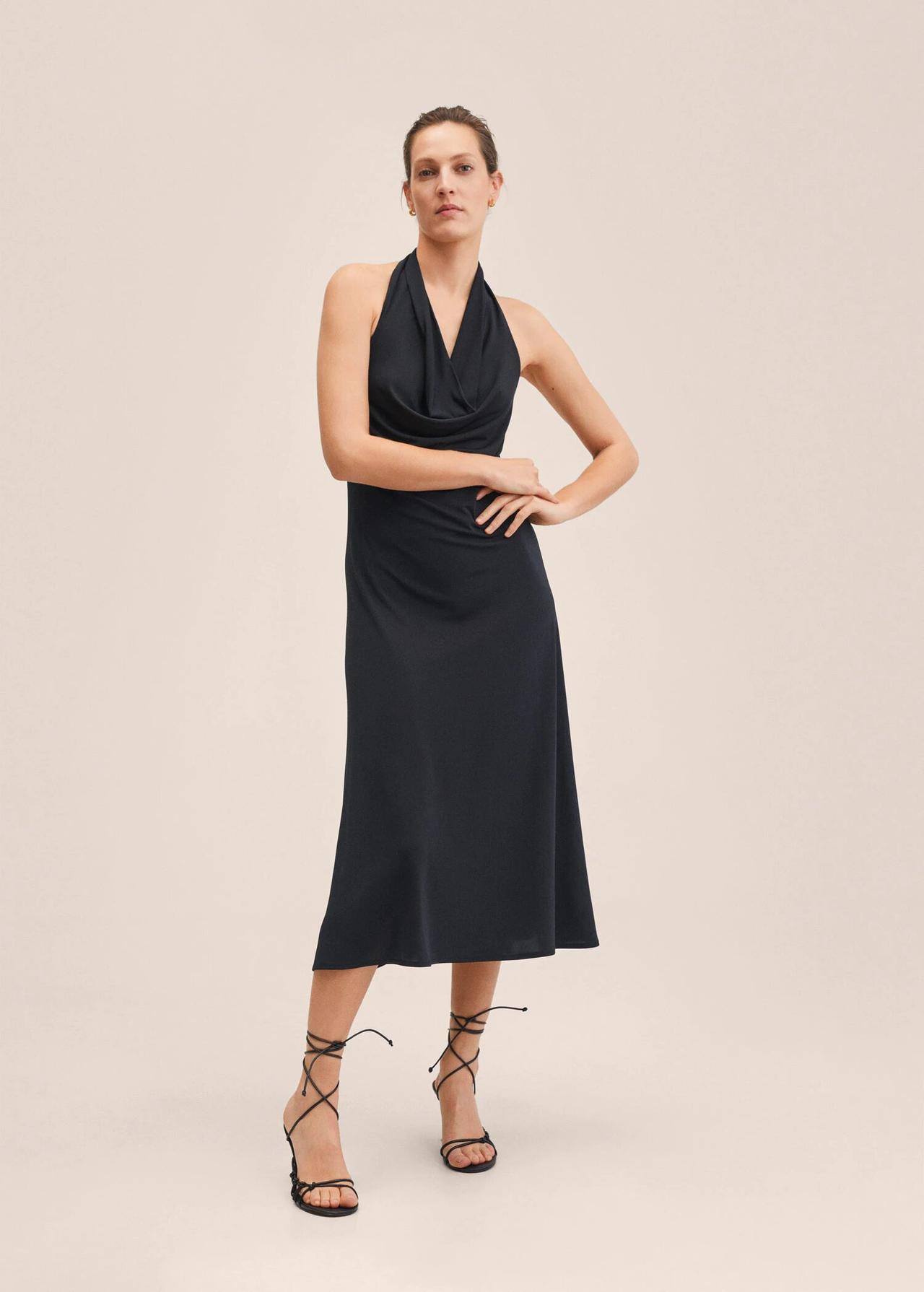 Model wearing a black halter neck bridesmaid dress