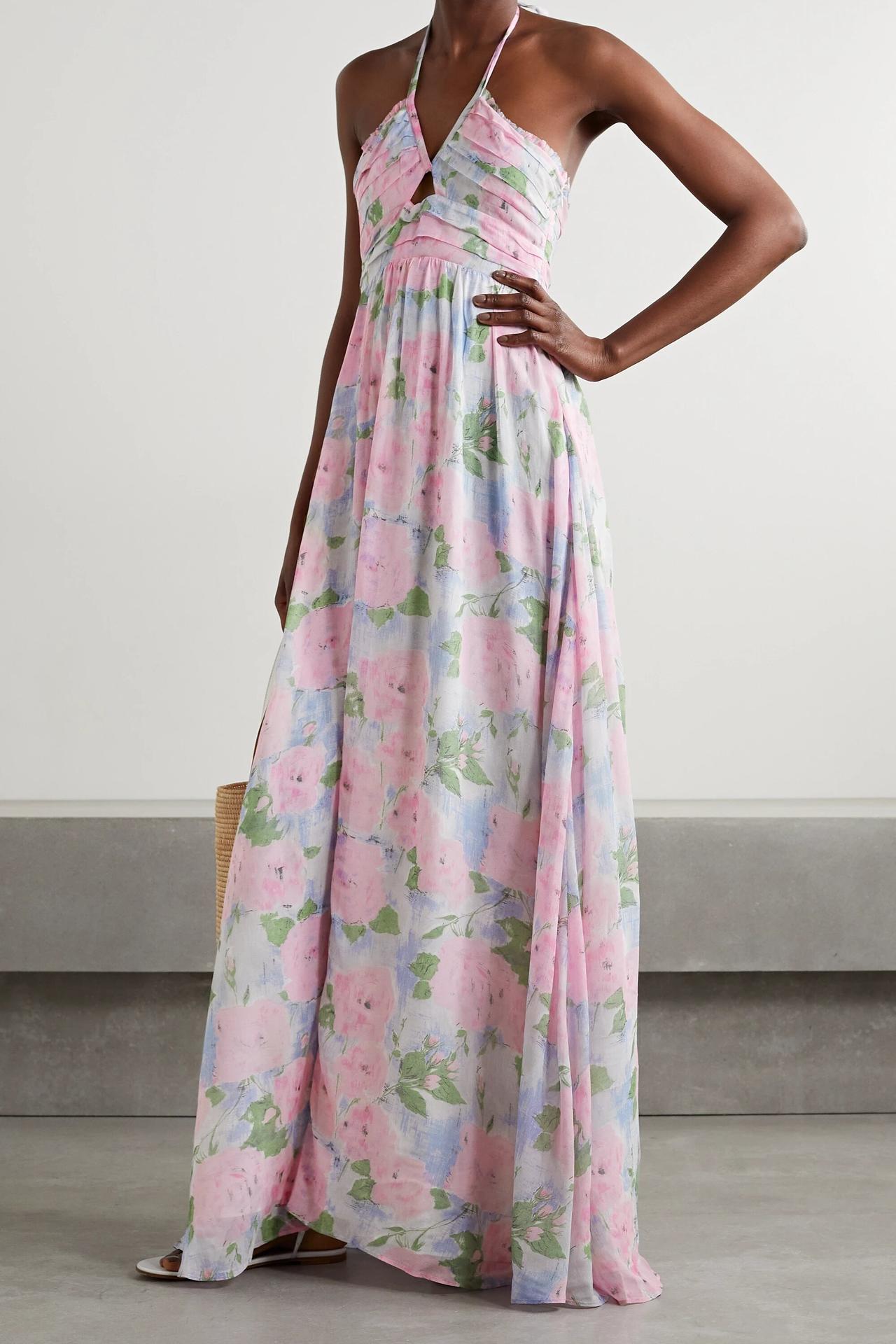 Model wearing a floral halter-neck wedding guest dress