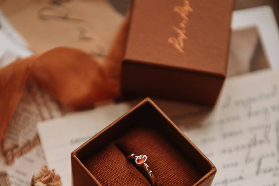 Birthstone proposal ring in a jewellery box