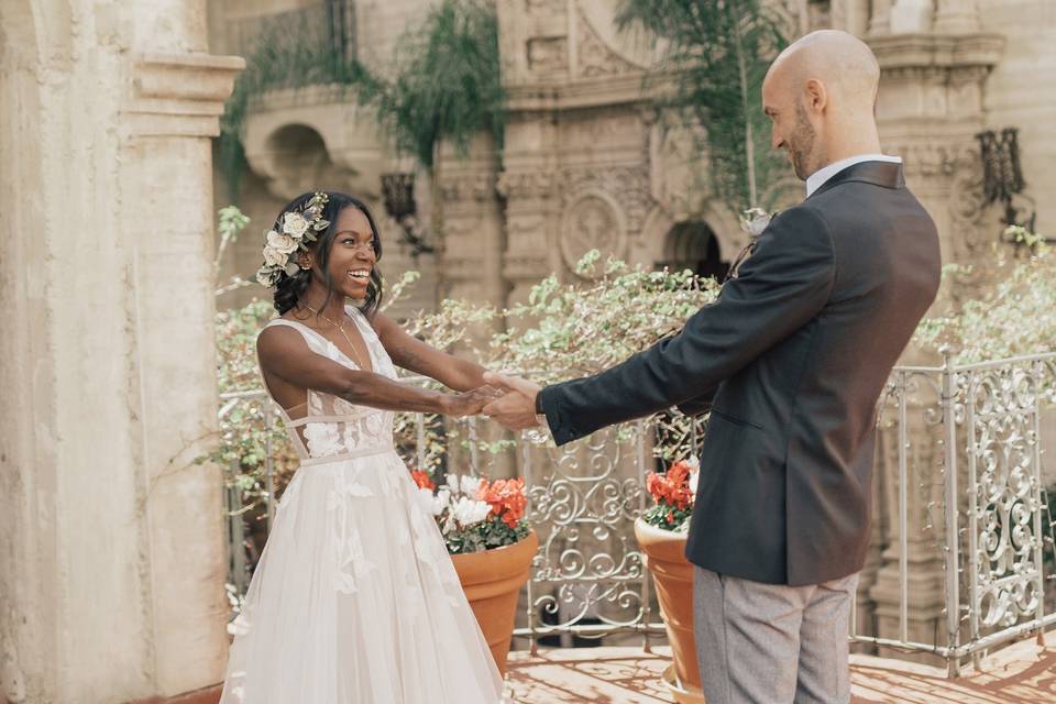 Bride and groom holding hands during a wedding first look