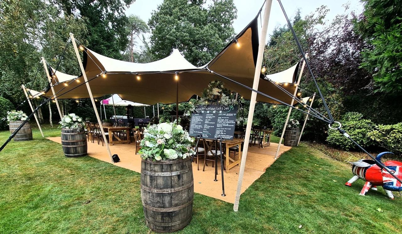 Wedding marquee bar decorated with flowers