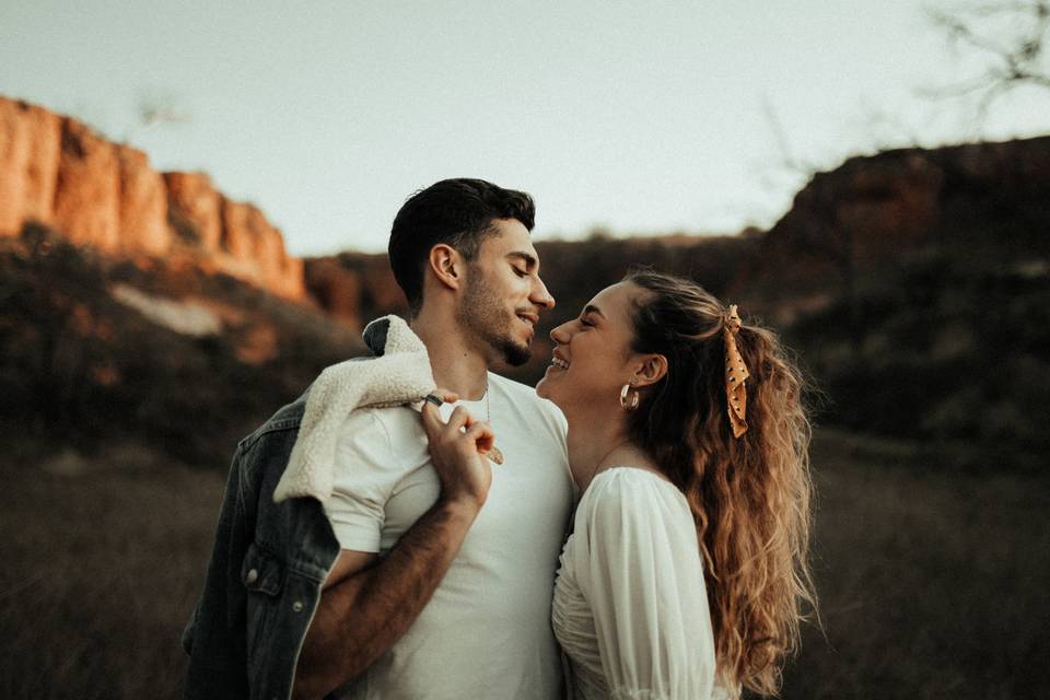 Couple in the desert gazing into each other's eyes