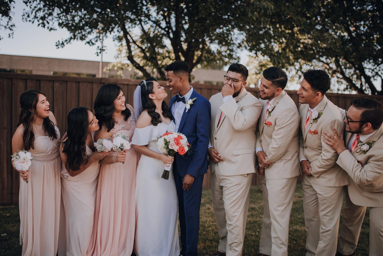 A wedding party with a couple, three bridesmaids and four ushers and groomsmen