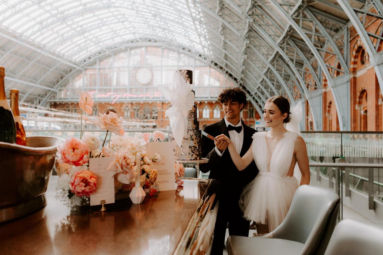Couple cutting the cake at their wedding
