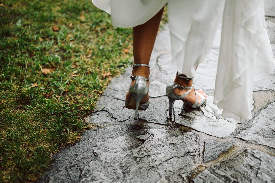 Bride walking in the rain