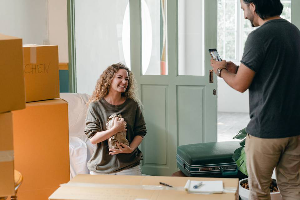 Couple packing up their home into boxes