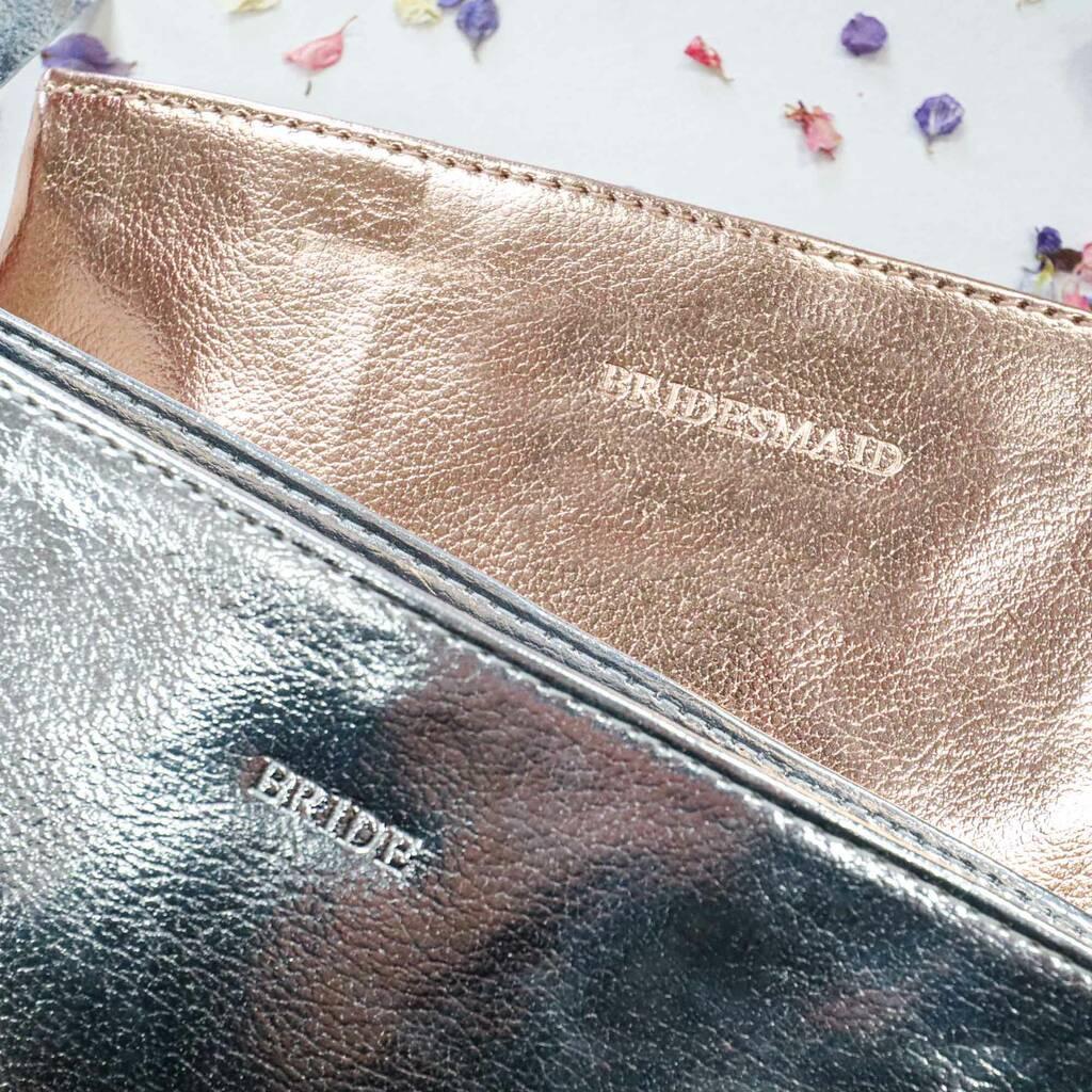 A silver bride makeup bag and a rose gold bridesmaid makeup bag
