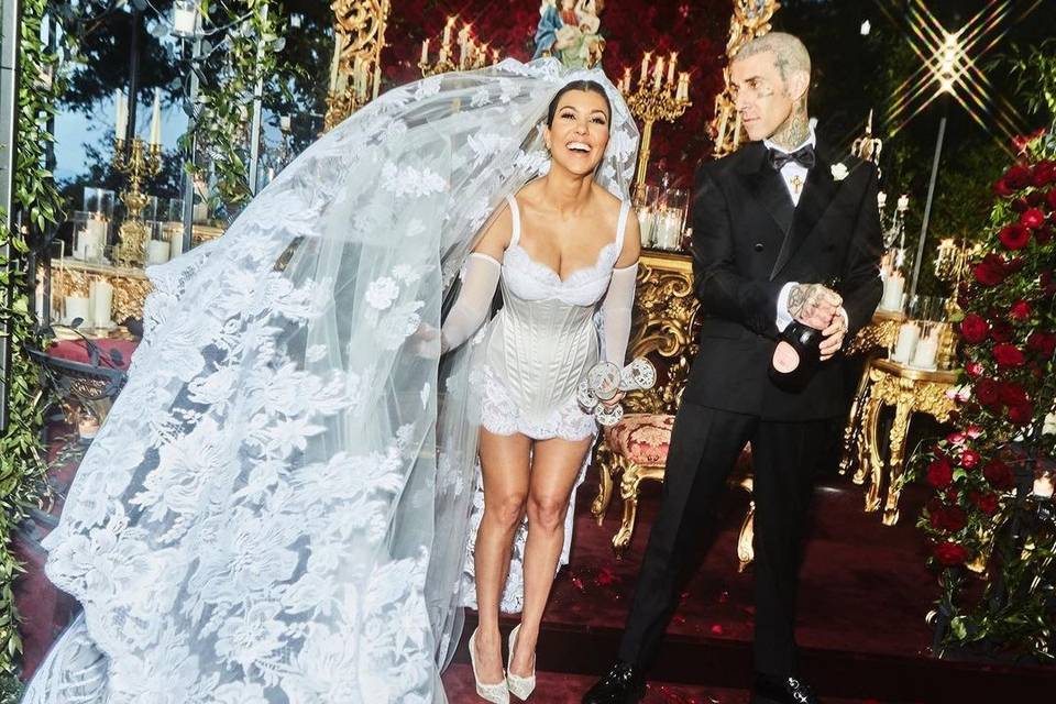 Kourtney Kardashian wearing an iconic celebrity wedding dress