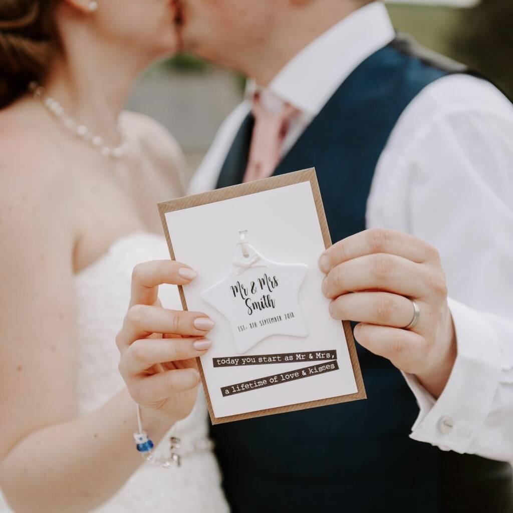 wedding card with ceramic star attached to it