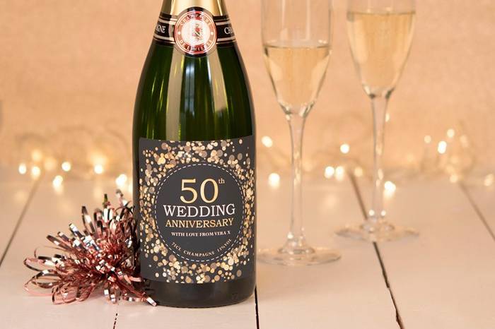 50th anniversary champagne bottle with flutes