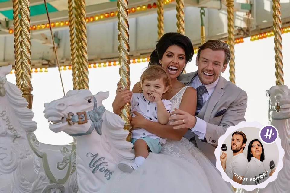 Cara Delahoyde and Nathan Massey on their wedding day riding on a carousel and laughing with their baby son