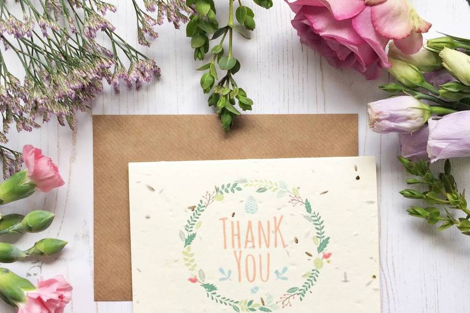 Seeded thank you card surrounded by flowers