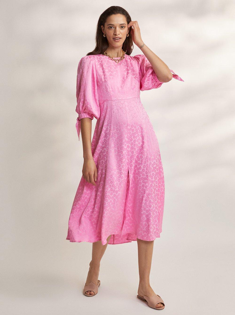 Model wearing a pink midi dress