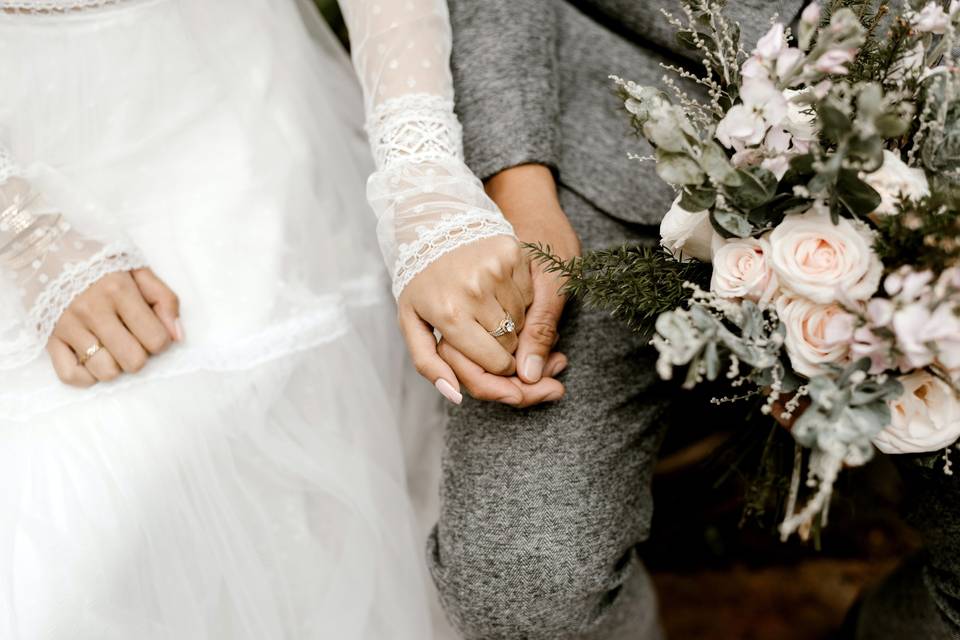 Bride and groom holding hands