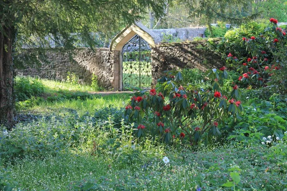 Garden with a stone walled arch and gate