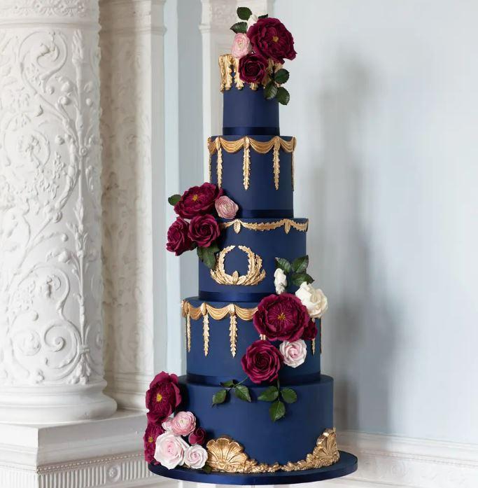 navy and gold wedding cake with five tiers