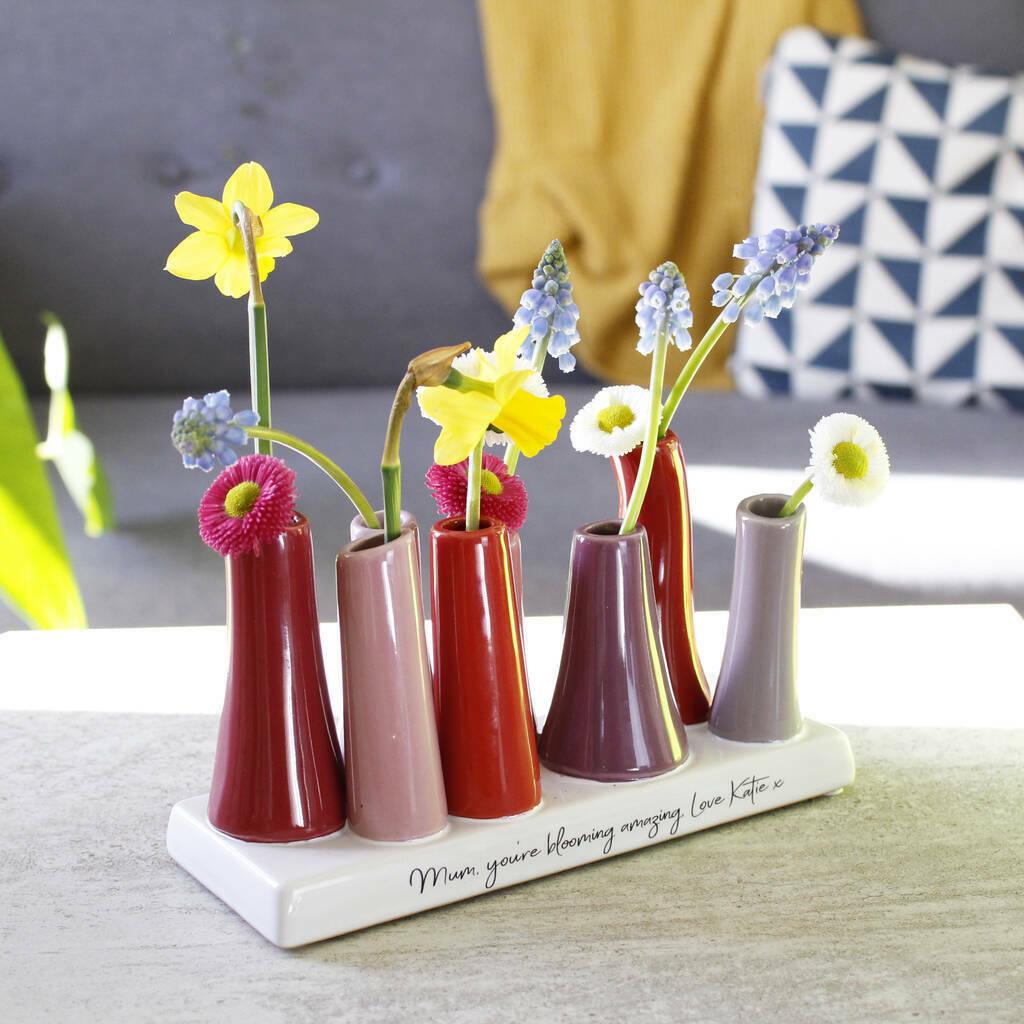 A colourful multi-stem vase with personal message for the mother of the bride on the base in script font.