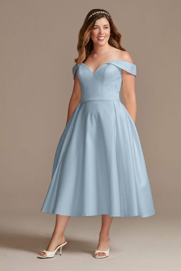 Model wearing an off the shoulder tea-length blue wedding dress