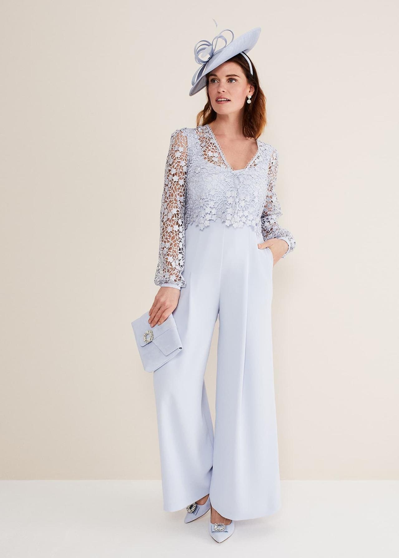 Model wearing a lace light blue jumpsuit