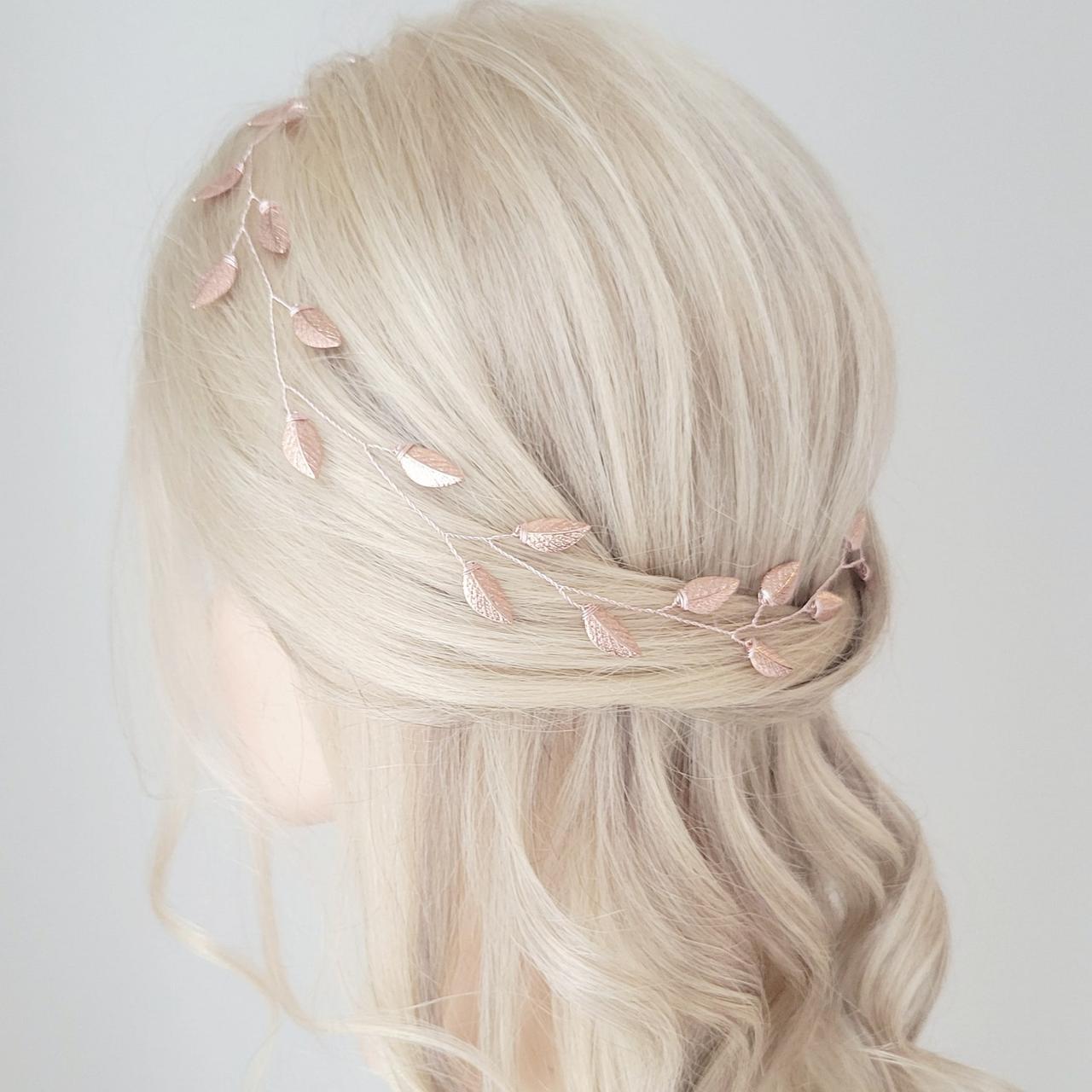 A delicate rose gold headband with rose gold leaves