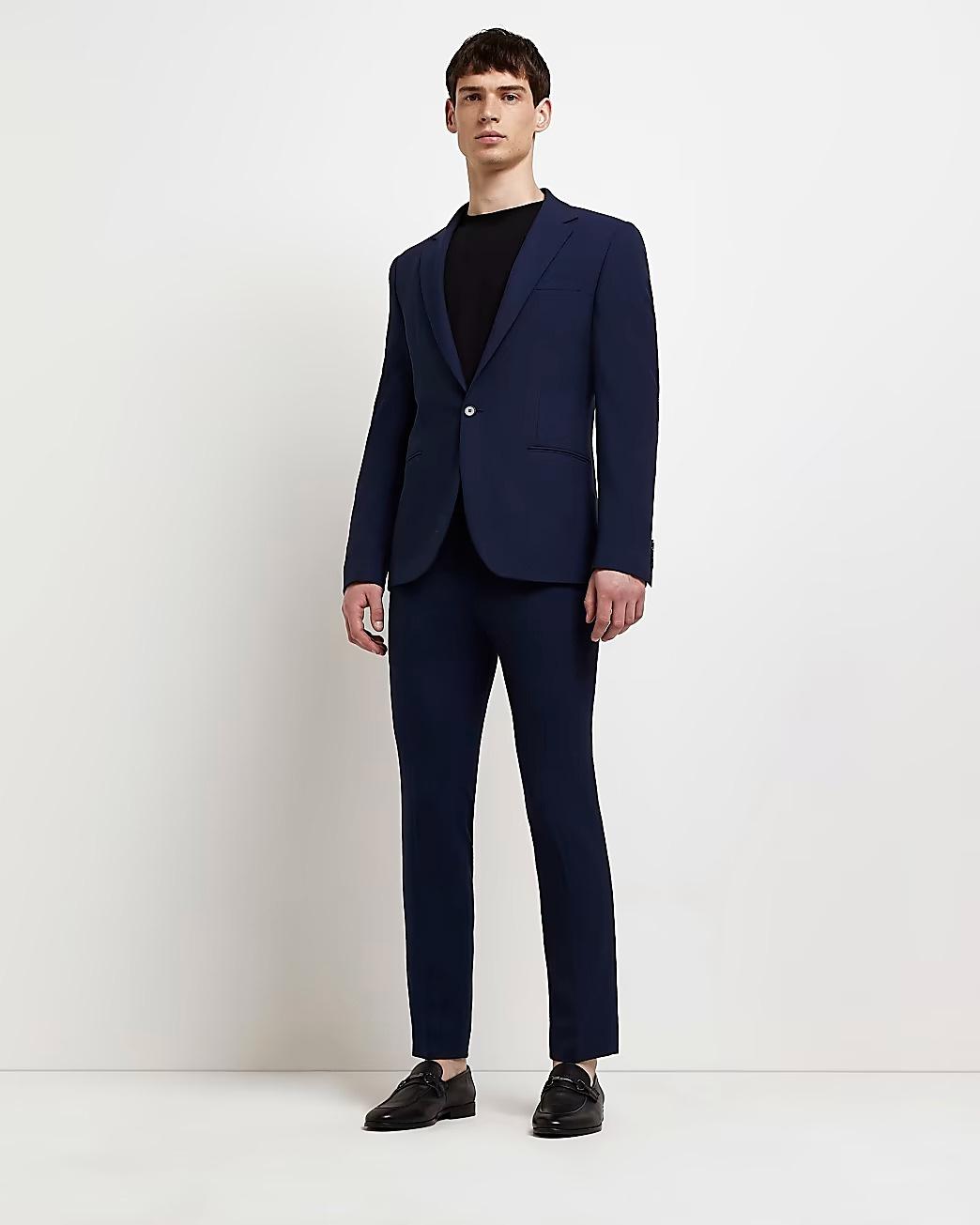 Model wearing a navy slim suit 