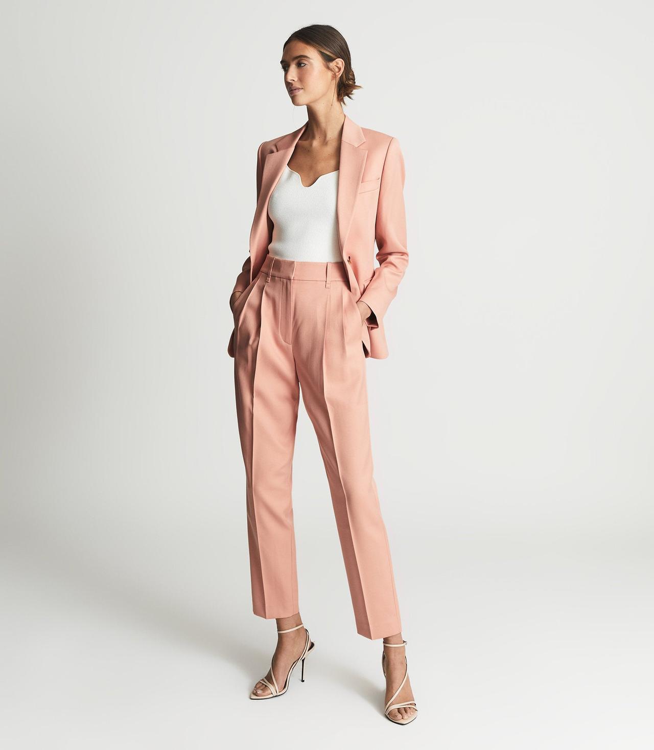 Model wearing a pink suit