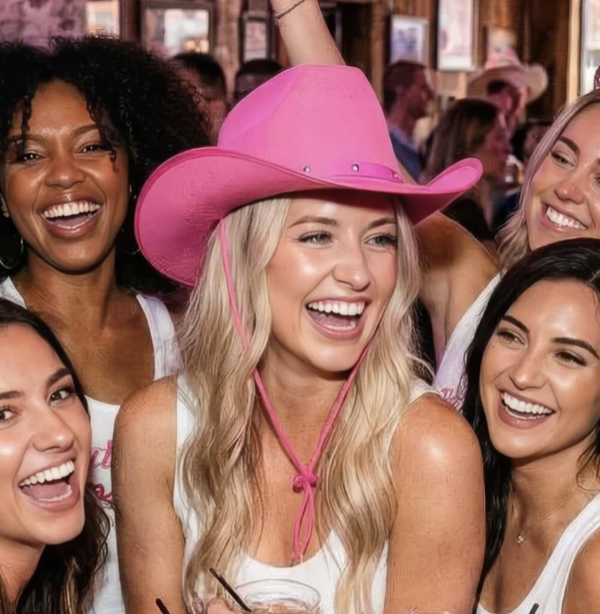 blonde wearing a pink cowboy hat with her friends