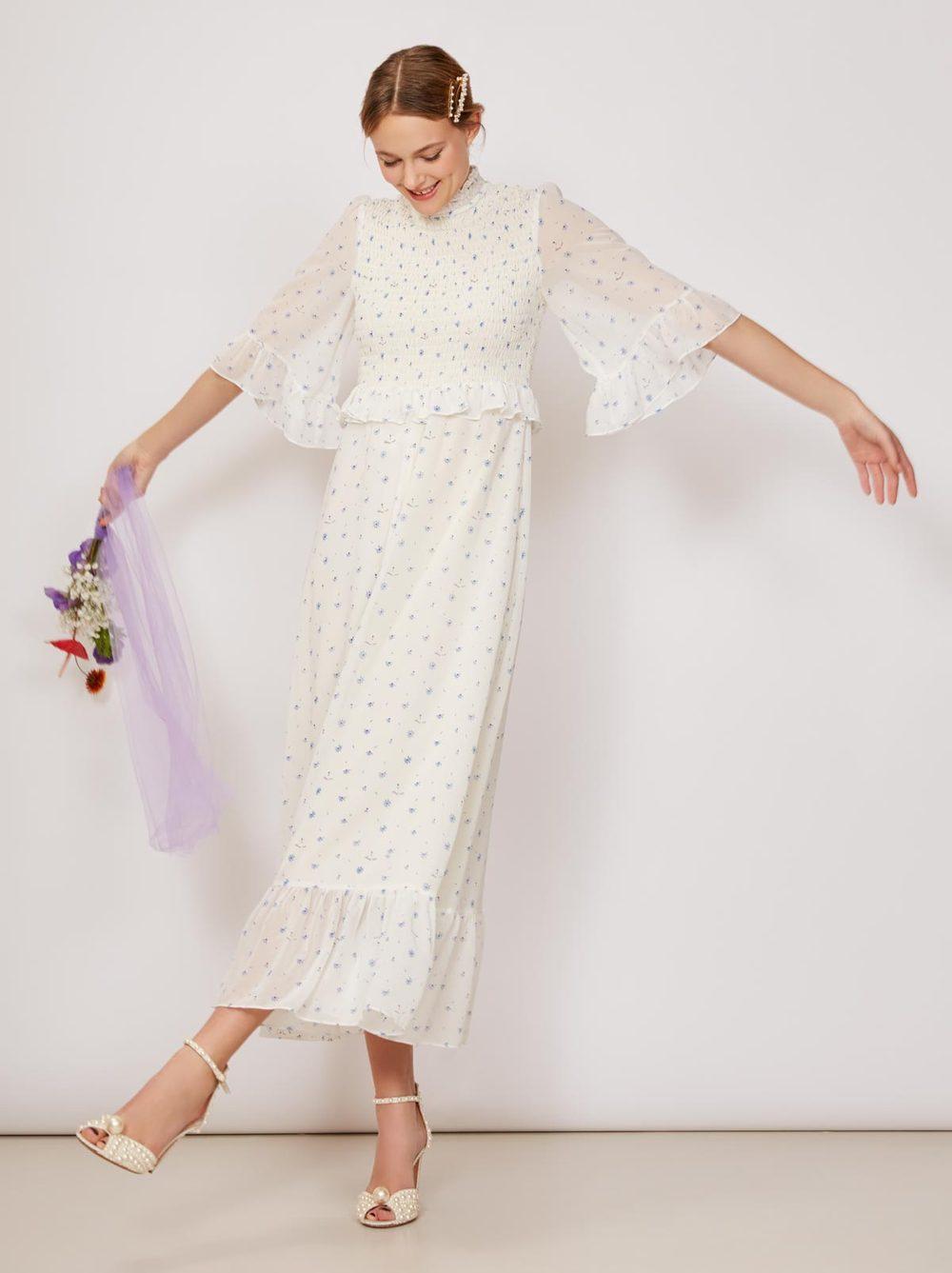 White and blue Kitri Studio wedding dress with three-quarter flutter sleeves