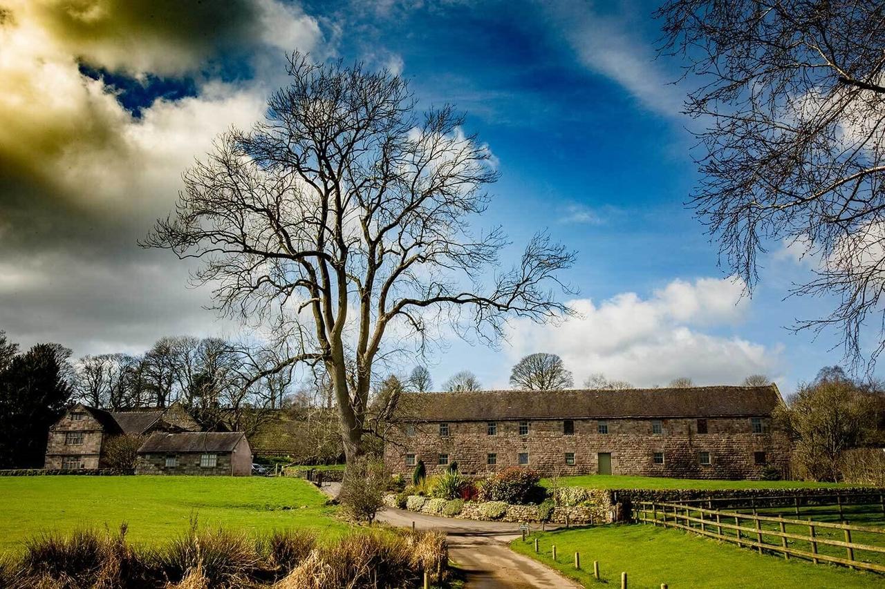 Exterior of an old stone barn wedding venue on a bright winter's day