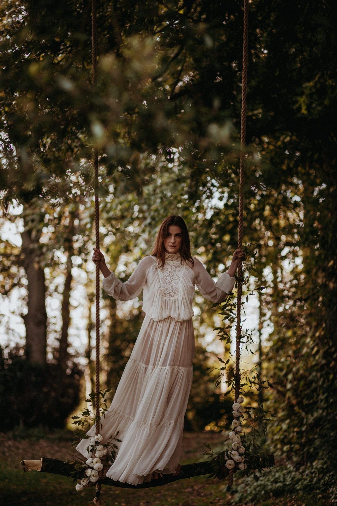 Model wearing a vintage style long sleeved wedding dress