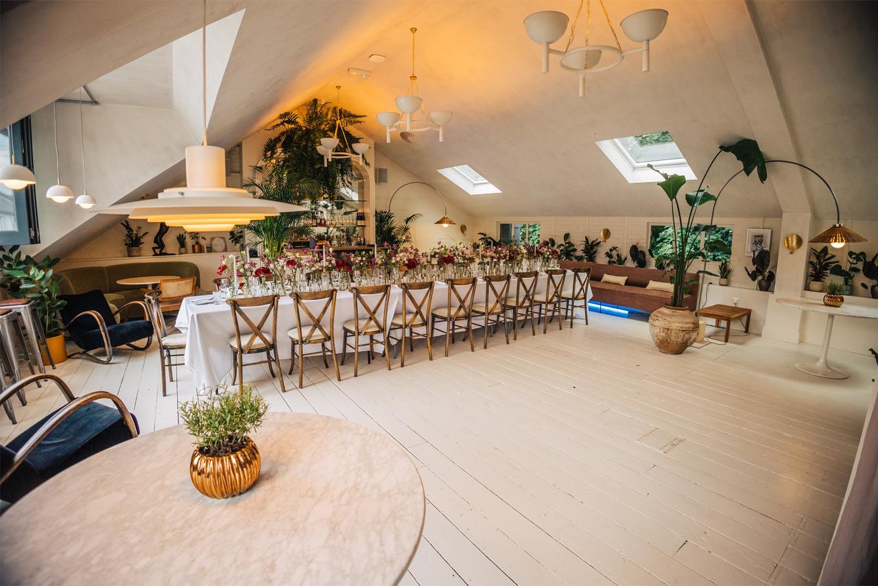 a white lofty room with skylights and modern fittings dressed for a city London wedding