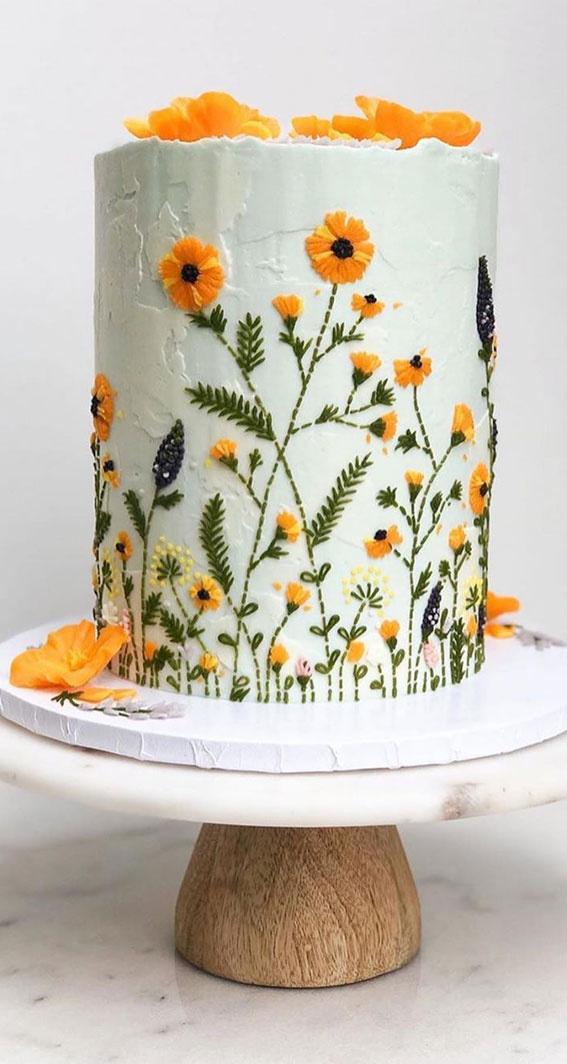 One tier white rustic wedding cake with yellow embroidery effect flowers