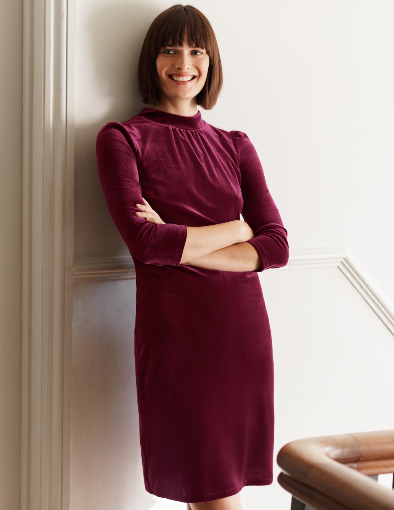 Image of a model wearing a ruby-colored shift dress