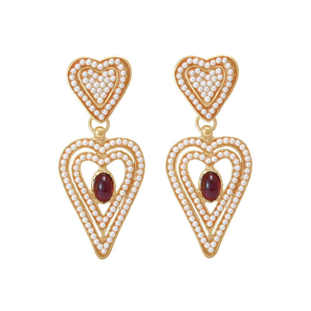 Pair of double heart drop earrings studded with tiny pearls with a red garnet at the centre of each earring