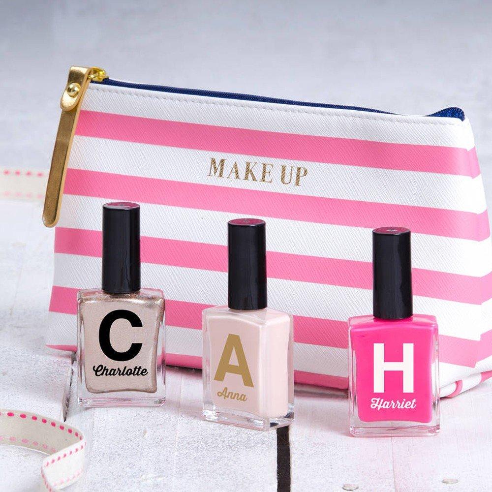 Pink striped makeup bag with personalised nail polishes