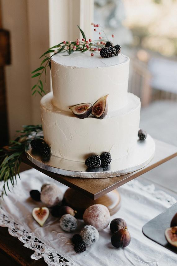 White two tiered rustic wedding cake with figs