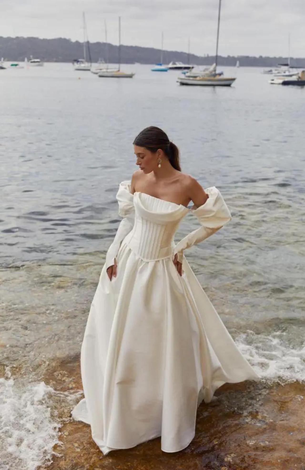 Basque white wedding dress in shore scene 