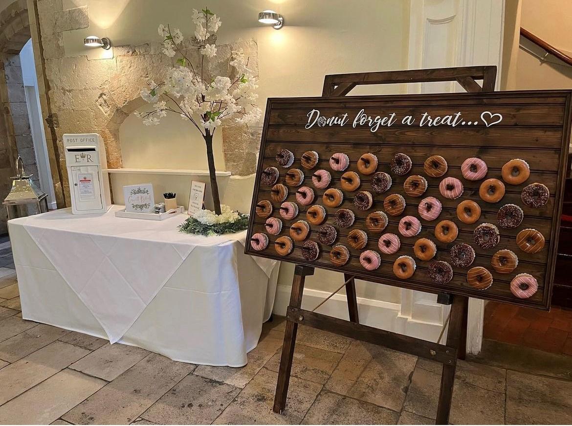 a romantic donut wall decorated for a wedding