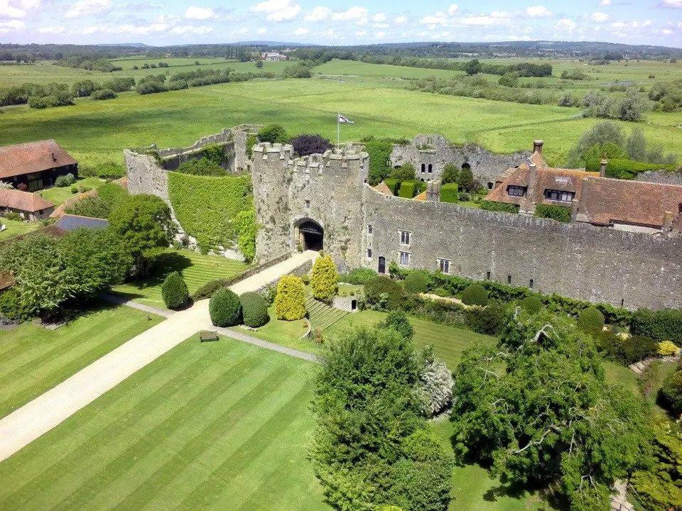 An aerial view of Amberley Castle surrounded by greenery