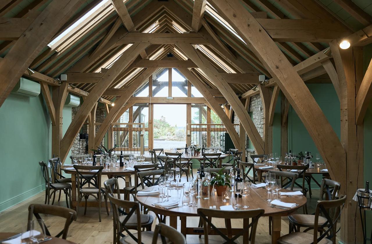 barn reception dining room of Mad Swans in the Mendips perfect for a winter wedding ceremony