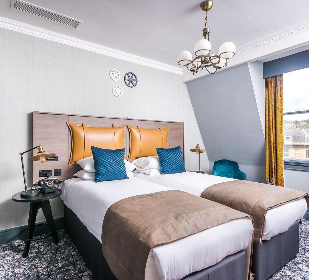 A room with blue and mustard decor at a midrange hen party hotel in Bath