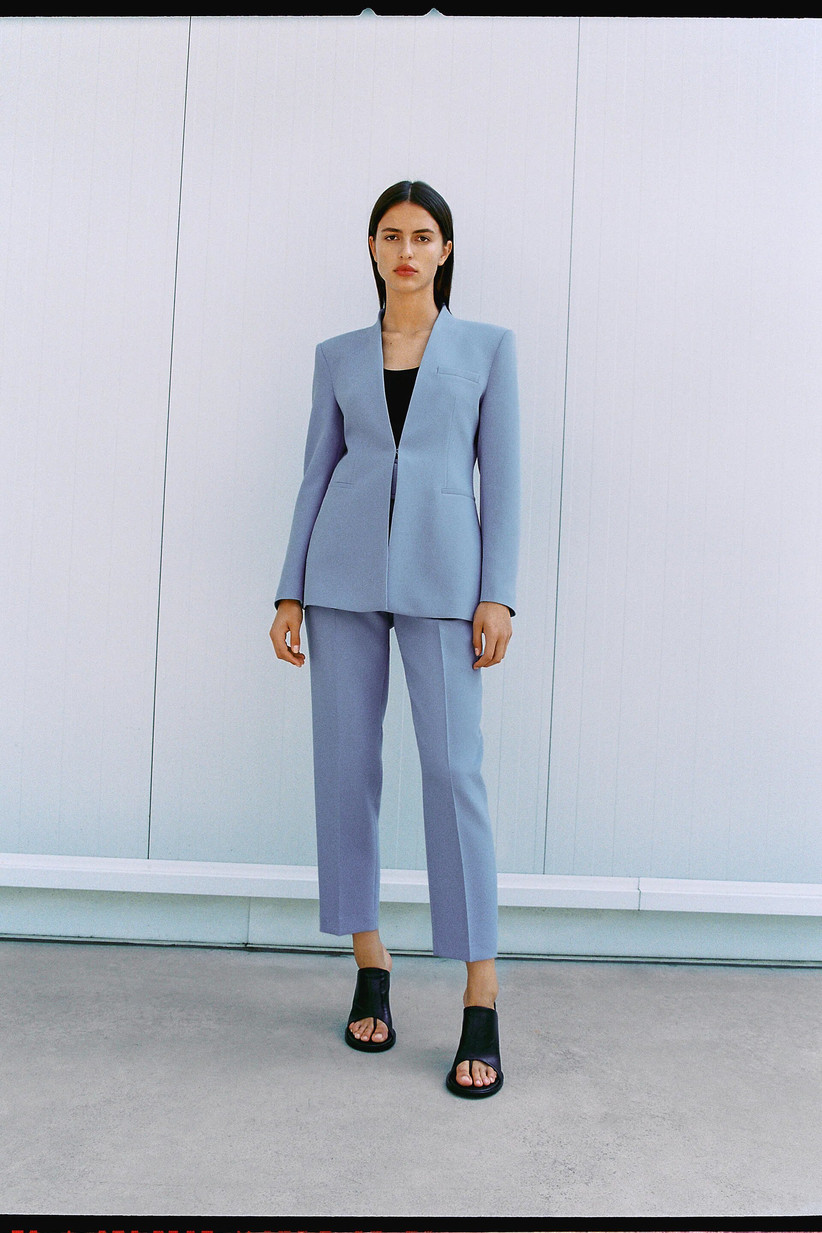 Model wearing a blue blazer and trouser mother of the groom set