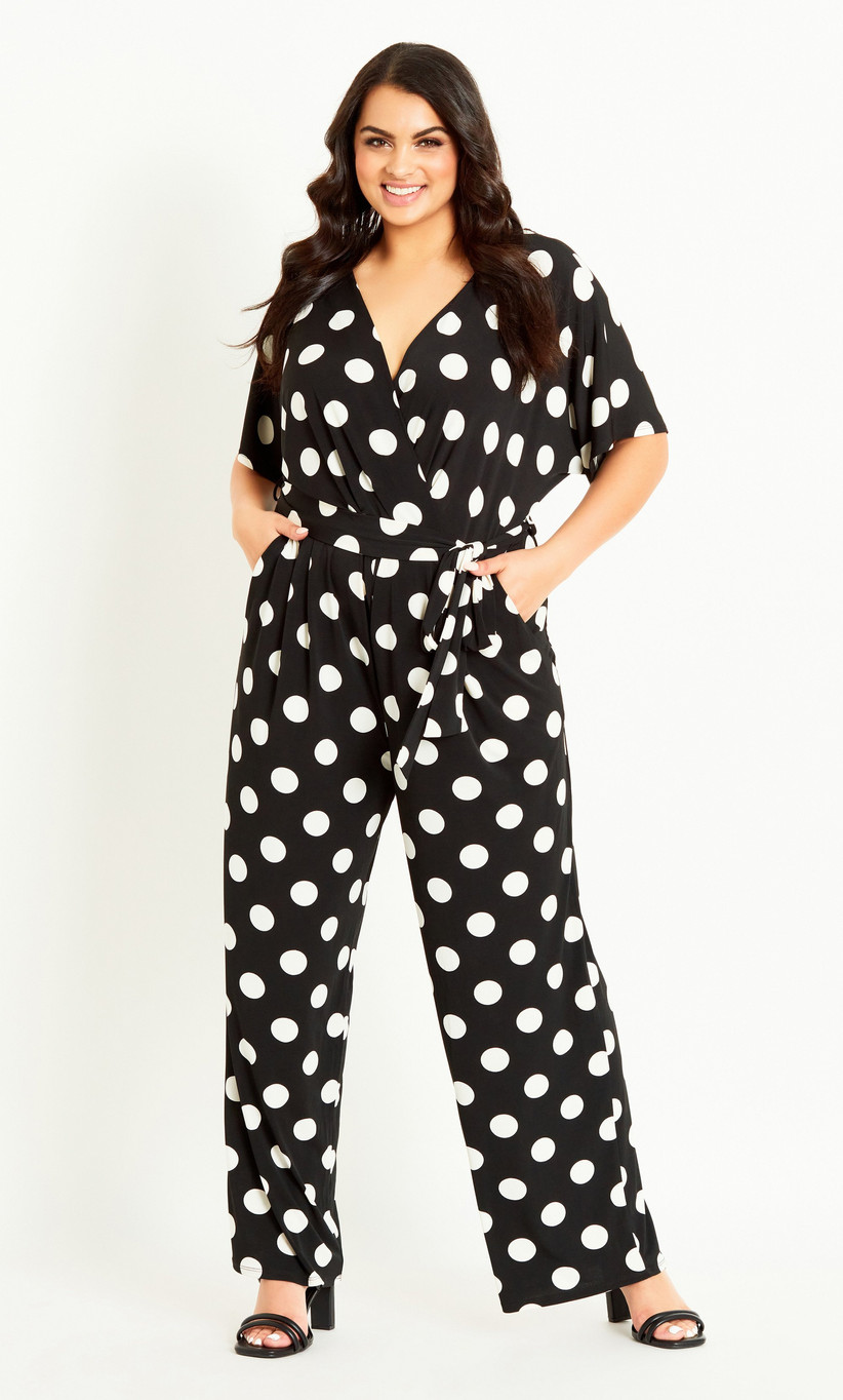 Model wearing a monochrome polka dot jumpsuit 