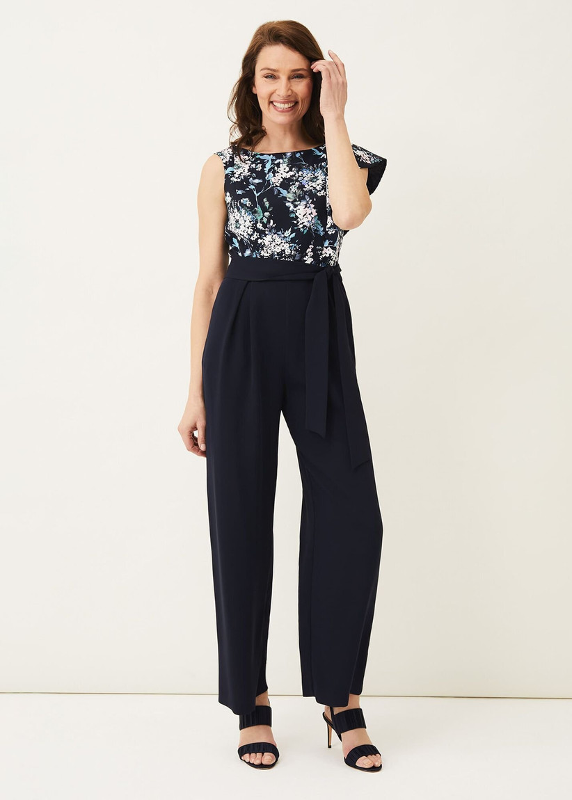 Jumpsuit with black trousers and a black and white floral top