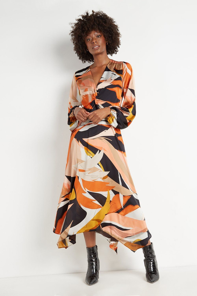 Model wearing a printed mother of the groom dress